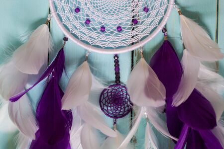 Colorful Dreamcatcher made of feathers leather beads and ropes, hanging, handmadeの写真素材