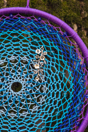 Colorful Dreamcatcher made of feathers leather beads and ropes, hanging, handmadeの写真素材