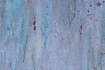 Corroded metal background. Rusted painted metal wall corrosion with streaks of rustの写真素材