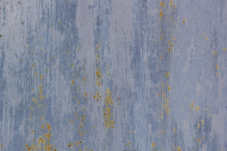 Corroded metal background. Rusted painted metal wall corrosion with streaks of rustの写真素材