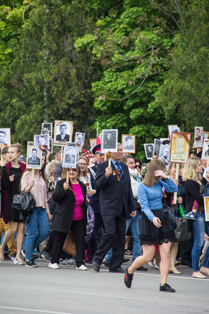 NOVOCHERKASSK, RUSSIA - MAY 9, 2017 - Victory Day: The immortal regiment parade in the centre of the city of Novocherkassk. People with portraits of the victims of the Second World war.のeditorial素材