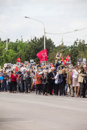 NOVOCHERKASSK, RUSSIA - MAY 9, 2017 - Victory Day: The immortal regiment parade in the centre of the city of Novocherkassk. People with portraits of the victims of the Second World war.のeditorial素材