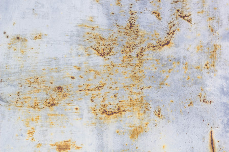 Corroded metal background. Rusted painted metal wall corrosion with streaks of rustの写真素材