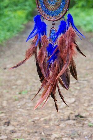 Dream catcher with feathers threads and beads rope hanging. Dreamcatcher handmadeの写真素材