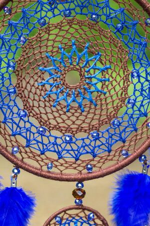 Dream catcher with feathers threads and beads rope hanging. Dreamcatcher handmadeの写真素材
