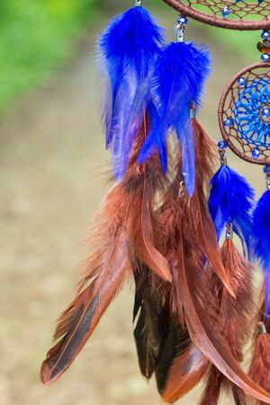 Dream catcher with feathers threads and beads rope hanging. Dreamcatcher handmadeの写真素材