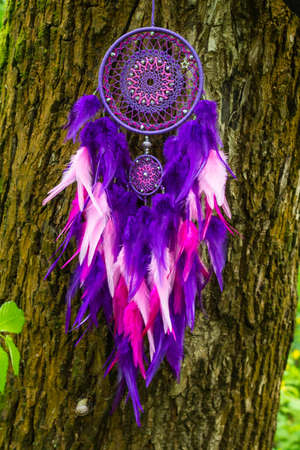 Dream catcher with feathers threads and beads rope hanging. Dreamcatcher handmadeの写真素材