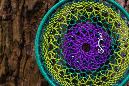 Dream catcher with feathers threads and beads rope hanging. Dreamcatcher handmadeの写真素材