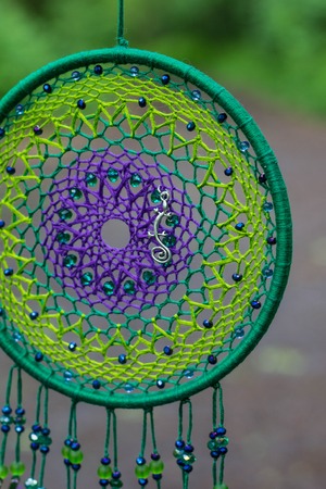 Dream catcher with feathers threads and beads rope hanging. Dreamcatcher handmadeの写真素材