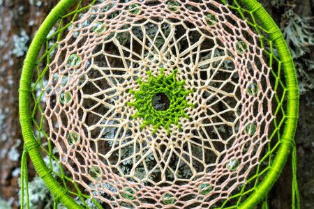 Dream catcher with feathers threads and beads rope hanging. Dreamcatcher handmadeの写真素材