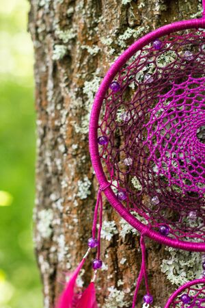 Dream catcher with feathers threads and beads rope hanging. Dreamcatcher handmadeの写真素材