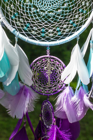Dream catcher with feathers threads and beads rope hanging. Dreamcatcher handmadeの写真素材