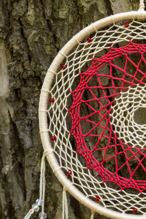Dream catcher with feathers threads and beads rope hanging. Dreamcatcher handmadeの写真素材