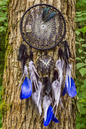 Dream catcher with feathers threads and beads rope hanging. Dreamcatcher handmadeの写真素材