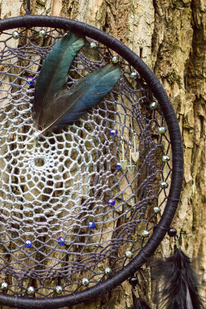 Dream catcher with feathers threads and beads rope hanging. Dreamcatcher handmadeの写真素材
