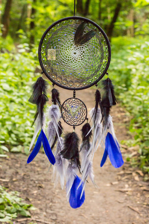 Dream catcher with feathers threads and beads rope hanging. Dreamcatcher handmadeの写真素材