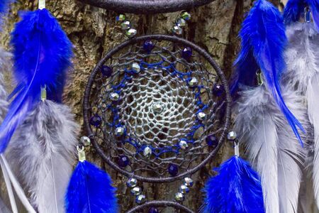 Dream catcher with feathers threads and beads rope hanging. Dreamcatcher handmadeの写真素材