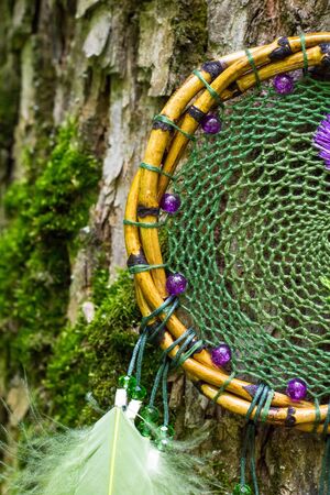 Dream catcher with feathers threads and beads rope hanging. Dreamcatcher handmadeの写真素材