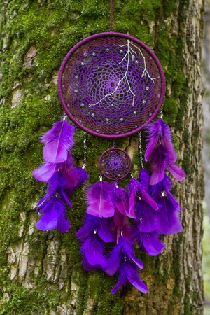 Dream catcher with feathers threads and beads rope hanging. Dreamcatcher handmadeの写真素材