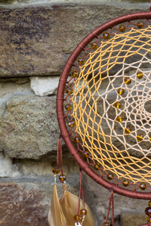 Dream catcher with feathers threads and beads rope hanging. Dreamcatcher handmadeの写真素材