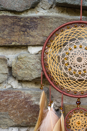Dream catcher with feathers threads and beads rope hanging. Dreamcatcher handmadeの写真素材