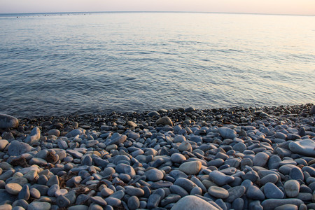 Sea and pebbles underwater in a beach. Pebble background.の写真素材