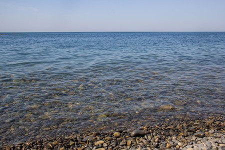 Calm Blue sea waves soft surface Ocean And Blue Sky Background.の写真素材