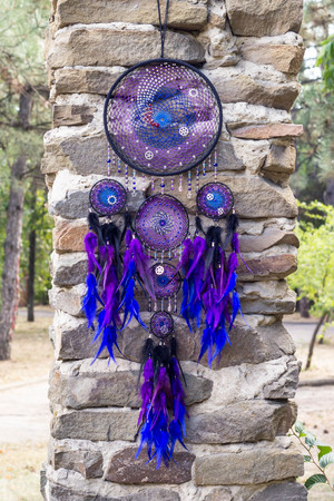 Dream catcher with feathers threads and beads rope hanging. Dreamcatcher handmadeの写真素材