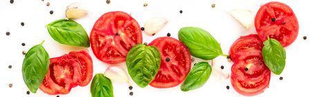 food background of tomato, garlic and basil on white background. Top view, copy space.の写真素材