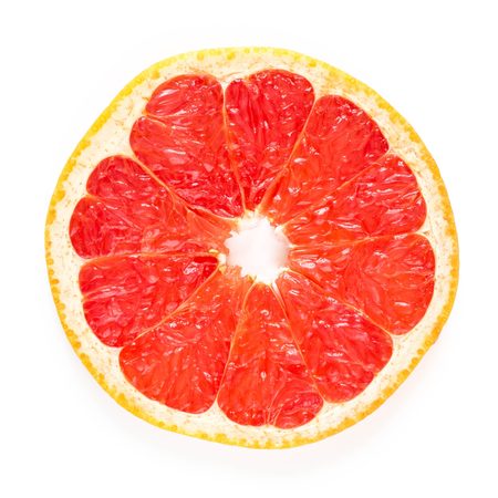Round slice of fresh Grapefruit on white background.の写真素材