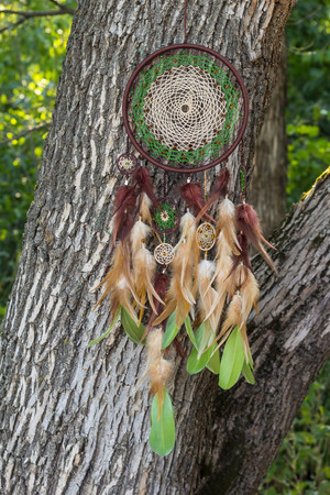 Dream catcher with feathers threads and beads rope hanging. Dreamcatcher handmadeの写真素材