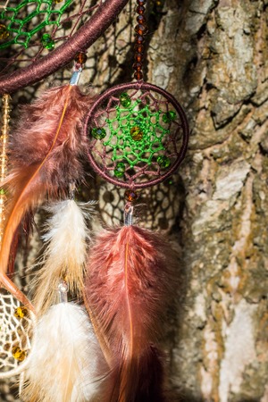 Dream catcher with feathers threads and beads rope hanging. Dreamcatcher handmadeの写真素材