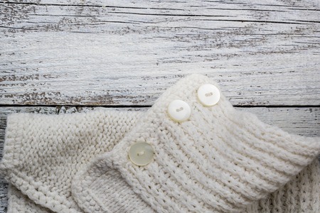 Part knitting on white wooden background with copyspace.の写真素材