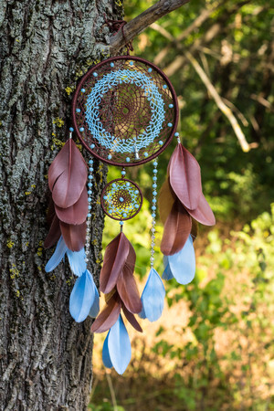 Dream catcher with feathers threads and beads rope hanging. Dreamcatcher handmadeの写真素材