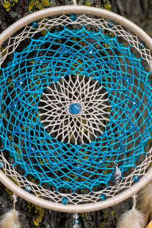 Dream catcher with feathers threads and beads rope hanging. Dreamcatcher handmadeの写真素材