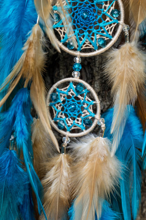 Dream catcher with feathers threads and beads rope hanging. Dreamcatcher handmadeの写真素材