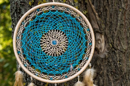 Dream catcher with feathers threads and beads rope hanging. Dreamcatcher handmadeの写真素材