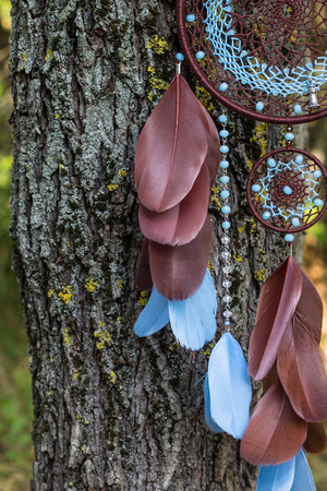 Dream catcher with feathers threads and beads rope hanging. Dreamcatcher handmadeの写真素材