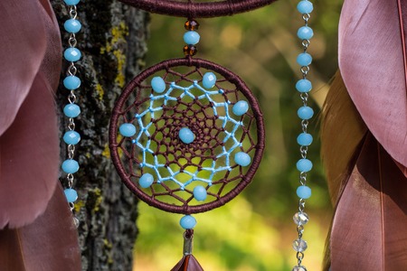 Dream catcher with feathers threads and beads rope hanging. Dreamcatcher handmadeの写真素材