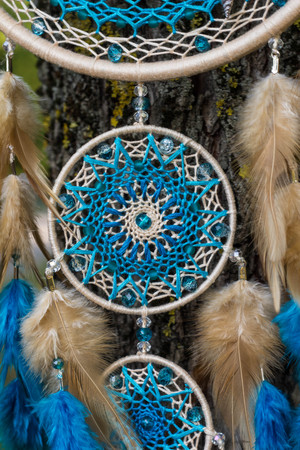 Dream catcher with feathers threads and beads rope hanging. Dreamcatcher handmadeの写真素材