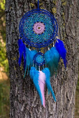 Dream catcher with feathers threads and beads rope hanging. Dreamcatcher handmadeの写真素材