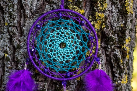 Dream catcher with feathers threads and beads rope hanging. Dreamcatcher handmadeの写真素材