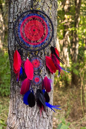 Dream catcher with feathers threads and beads rope hanging. Dreamcatcher handmadeの写真素材