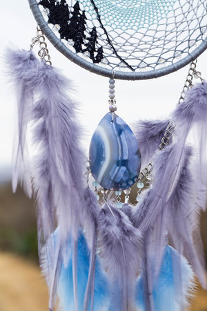 Dream catcher with feathers threads and beads rope hanging. Dreamcatcher handmadeの写真素材