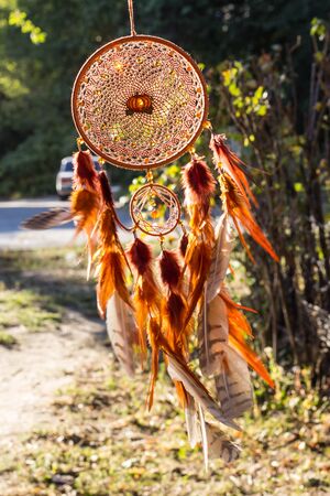 Dream catcher with feathers threads and beads rope hanging. Dreamcatcher handmadeの写真素材