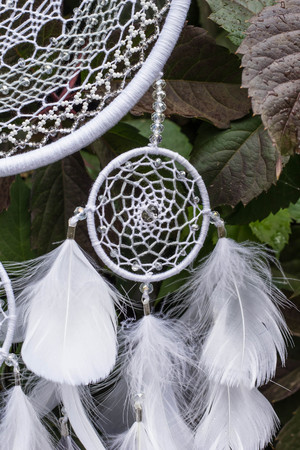 Dream catcher with feathers threads and beads rope hanging. Dreamcatcher handmadeの写真素材