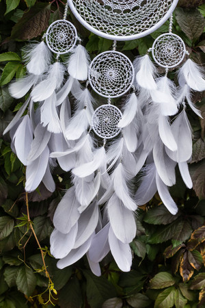 Dream catcher with feathers threads and beads rope hanging. Dreamcatcher handmadeの写真素材