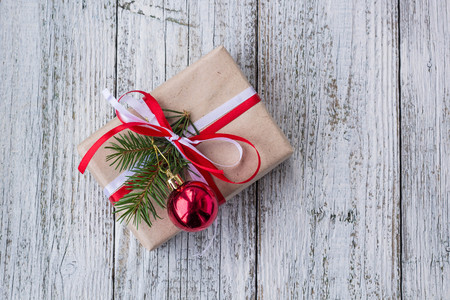 Christmas background with decorations and gift boxes on white wooden board. Copy space, top view.の写真素材