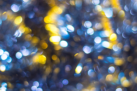 Blue Yellow White bokeh. Christmas background texture.の写真素材