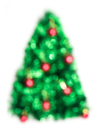 Green Christmas lights fir tree bokeh - A bright bokeh background created by Christmas lights.の写真素材